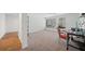 Bedroom featuring neutral carpet, a ceiling fan, large windows, and a convenient desk area at 302 W Country Dr, Johns Creek, GA 30097