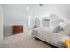 This bedroom features dormer windows, neutral paint, and soft carpet at 302 W Country Dr, Johns Creek, GA 30097