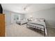This spacious bedroom features two twin beds, neutral paint, soft carpet, and a ceiling fan at 302 W Country Dr, Johns Creek, GA 30097