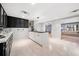 Stylish kitchen with tile floors and ample storage opening to Gathering room at 302 W Country Dr, Johns Creek, GA 30097