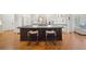 Kitchen island with seating and barstool, perfect for entertaining, and an open floor plan at 302 W Country Dr, Johns Creek, GA 30097