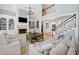 Airy living room with fireplace, built-in shelves and cathedral ceiling at 302 W Country Dr, Johns Creek, GA 30097