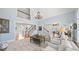 Spacious living room with tall ceilings, fireplace, and staircase at 302 W Country Dr, Johns Creek, GA 30097