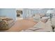 Cozy living room with light blue walls, plush seating, and carpeted floors at 302 W Country Dr, Johns Creek, GA 30097