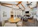 Outdoor patio with vaulted ceilings, ceiling fans, and comfortable seating at 302 W Country Dr, Johns Creek, GA 30097