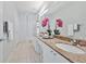 Bathroom with dual sinks, granite counters, and well-lit vanity area at 10 Perimeter Summit Ne Blvd # 1208, Brookhaven, GA 30319