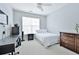 Bright bedroom with a ceiling fan, large window, and neutral decor at 10 Perimeter Summit Ne Blvd # 1208, Brookhaven, GA 30319