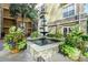 Charming courtyard featuring a fountain and manicured plants at 10 Perimeter Summit Ne Blvd # 1208, Brookhaven, GA 30319