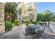 Outdoor patio area with seating and a charming fountain at 10 Perimeter Summit Ne Blvd # 1208, Brookhaven, GA 30319