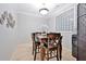 Cozy dining room with modern light fixture and unique glass block window at 10 Perimeter Summit Ne Blvd # 1208, Brookhaven, GA 30319