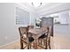 Dining room featuring wood table and seating, open to kitchen and living areas at 10 Perimeter Summit Ne Blvd # 1208, Brookhaven, GA 30319