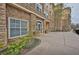 Condo entrance boasting manicured landscaping and attractive stone architecture at 10 Perimeter Summit Ne Blvd # 1208, Brookhaven, GA 30319