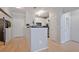 Open concept entryway with light hardwood flooring and views to the kitchen at 10 Perimeter Summit Ne Blvd # 1208, Brookhaven, GA 30319