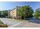 Three story condo building featuring a mix of stone and stucco exterior with street view at 10 Perimeter Summit Ne Blvd # 1208, Brookhaven, GA 30319