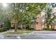 Beautiful condo building featuring well-maintained landscaping and an attractive brick facade at 10 Perimeter Summit Ne Blvd # 1208, Brookhaven, GA 30319
