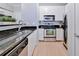 Modern kitchen featuring stainless steel appliances, sleek countertops, and ample cabinet space at 10 Perimeter Summit Ne Blvd # 1208, Brookhaven, GA 30319