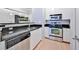 Modern kitchen featuring stainless steel appliances, sleek countertops, and ample cabinet space at 10 Perimeter Summit Ne Blvd # 1208, Brookhaven, GA 30319