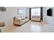 Bright living room features hardwood floors, large window, and neutral-toned furniture at 10 Perimeter Summit Ne Blvd # 1208, Brookhaven, GA 30319