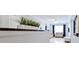 Bright living room showcases hardwood floors, a white sofa, and a plant on a countertop at 10 Perimeter Summit Ne Blvd # 1208, Brookhaven, GA 30319