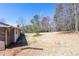 Large backyard with new construction and mature trees at 6175 Marilla St, Douglasville, GA 30135