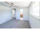 Bedroom featuring a ceiling fan, carpet, and en suite bath at 6175 Marilla St, Douglasville, GA 30135