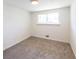 Cozy bedroom with neutral walls, carpet flooring, and plenty of natural light at 6175 Marilla St, Douglasville, GA 30135