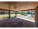 Open carport area with brick columns, providing shelter and a view of the driveway and surrounding landscape at 6175 Marilla St, Douglasville, GA 30135