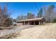Brick home with carport and a light blue front door on a well-sized lot at 6175 Marilla St, Douglasville, GA 30135