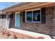 Charming brick home with blue door and black shutters at 6175 Marilla St, Douglasville, GA 30135