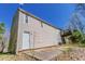 Back exterior view of house, showing the siding and an elevated wooden deck at 1270 Della Way, Lawrenceville, GA 30043