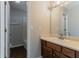 Bathroom featuring a modern vanity with wood cabinetry and a shower with a white tile surround at 1270 Della Way, Lawrenceville, GA 30043