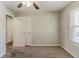 Bedroom featuring carpet and double-door closet with window at 1270 Della Way, Lawrenceville, GA 30043