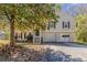 Charming home featuring a two car garage, traditional siding, and black shutters at 1270 Della Way, Lawrenceville, GA 30043