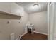Laundry room with sink, utility hookups, and overhead storage at 1270 Della Way, Lawrenceville, GA 30043