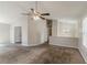 Bright living room features vaulted ceilings, a ceiling fan, and neutral paint tones at 1270 Della Way, Lawrenceville, GA 30043