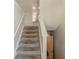 Carpeted staircase leading to the upper level of the home at 1270 Della Way, Lawrenceville, GA 30043