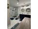 Bathroom featuring dual sinks, framed mirrors, and a glass enclosed shower for a spa-like experience at 3533 Johns Rd, Tucker, GA 30084