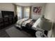 Comfortable bedroom with a queen bed, modern decor, and two windows for ample natural light at 3533 Johns Rd, Tucker, GA 30084