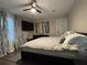 Bright bedroom with modern ceiling fan and artwork, providing a stylish and comfortable living space at 3533 Johns Rd, Tucker, GA 30084