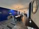 Dining room with modern light fixtures, wood floors, and a view into the kitchen at 3533 Johns Rd, Tucker, GA 30084