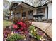 Charming home with a covered porch and beautifully landscaped front yard with colorful flowers at 3533 Johns Rd, Tucker, GA 30084