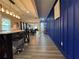 Hallway featuring modern decor with plank flooring leading to an open concept living space at 3533 Johns Rd, Tucker, GA 30084