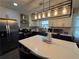 Modern kitchen with stainless steel appliances, white countertops, two-tone cabinets and a large island at 3533 Johns Rd, Tucker, GA 30084