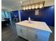 Stylish kitchen featuring a white center island with quartz countertop and modern pendant lighting at 3533 Johns Rd, Tucker, GA 30084