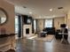 Cozy living room features a brick fireplace, hardwood floors, and large windows with natural light at 3533 Johns Rd, Tucker, GA 30084