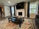 Inviting living room with fireplace, modern furniture and colorful area rug at 3533 Johns Rd, Tucker, GA 30084