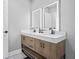 Bathroom featuring a double sink vanity with marble countertops and mirrors at 992 Beckwith Sw St, Atlanta, GA 30314