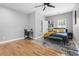 Bedroom with a ceiling fan, hardwood floors, and ensuite bath at 992 Beckwith Sw St, Atlanta, GA 30314