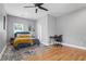 Cozy bedroom with a ceiling fan, desk, and natural light at 992 Beckwith Sw St, Atlanta, GA 30314
