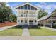 Inviting two-story home with double porches, a well-kept lawn, and a long driveway at 992 Beckwith Sw St, Atlanta, GA 30314